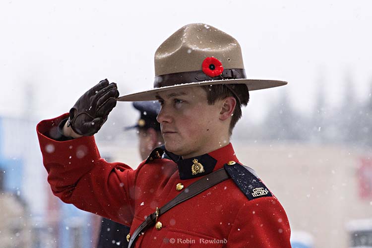 Cst. Brad Walsh salutes during the Remembrance Day ceremony