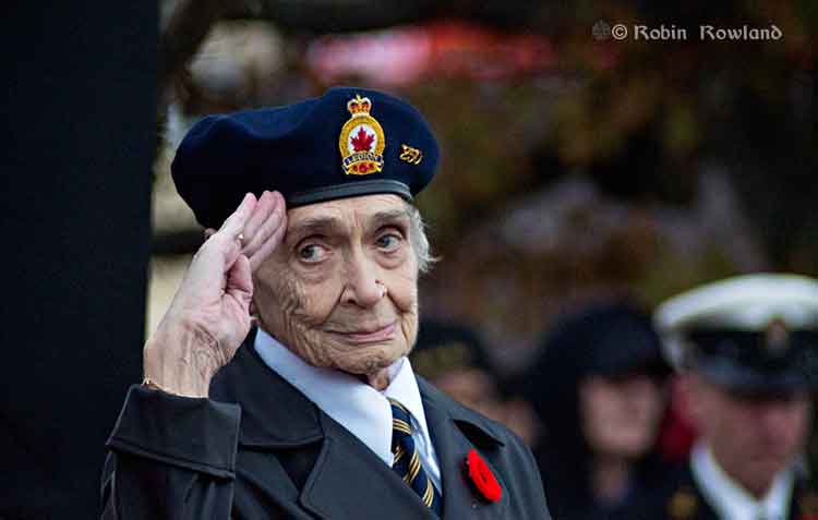 Merle Archer salutes at the Remembrance Day ceremony